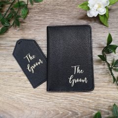 black passport holder and tag