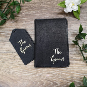 black passport holder and tag