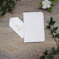 white passport holder and tag