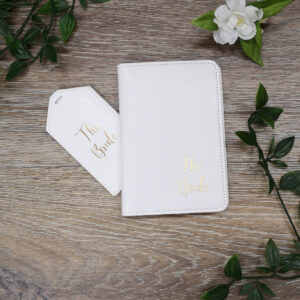 white passport holder and tag